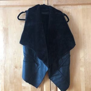 BlankNYC black pleather vest with foe fur on the inside. Size XS